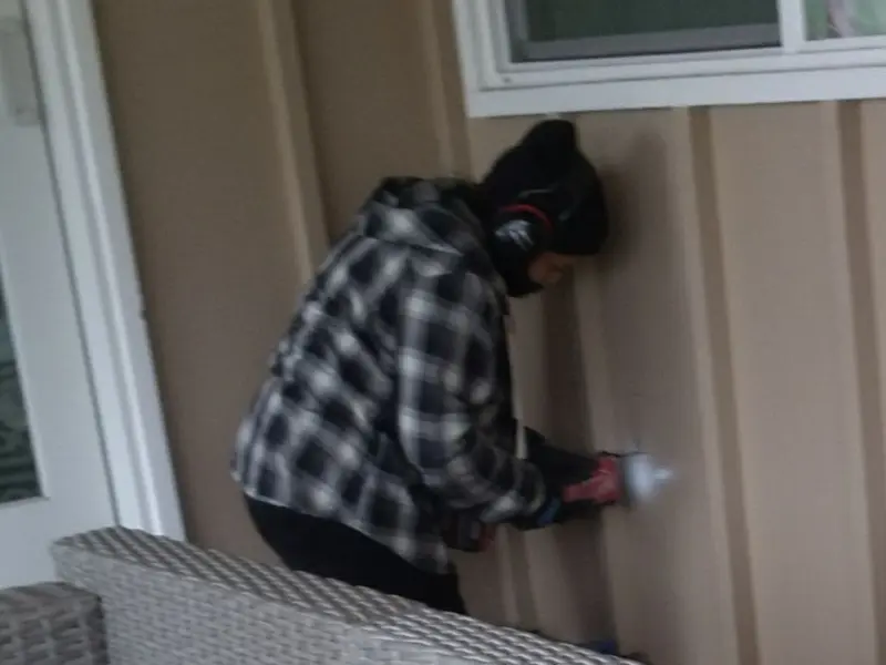 Professional electrician installing an exterior outlet in Westminster