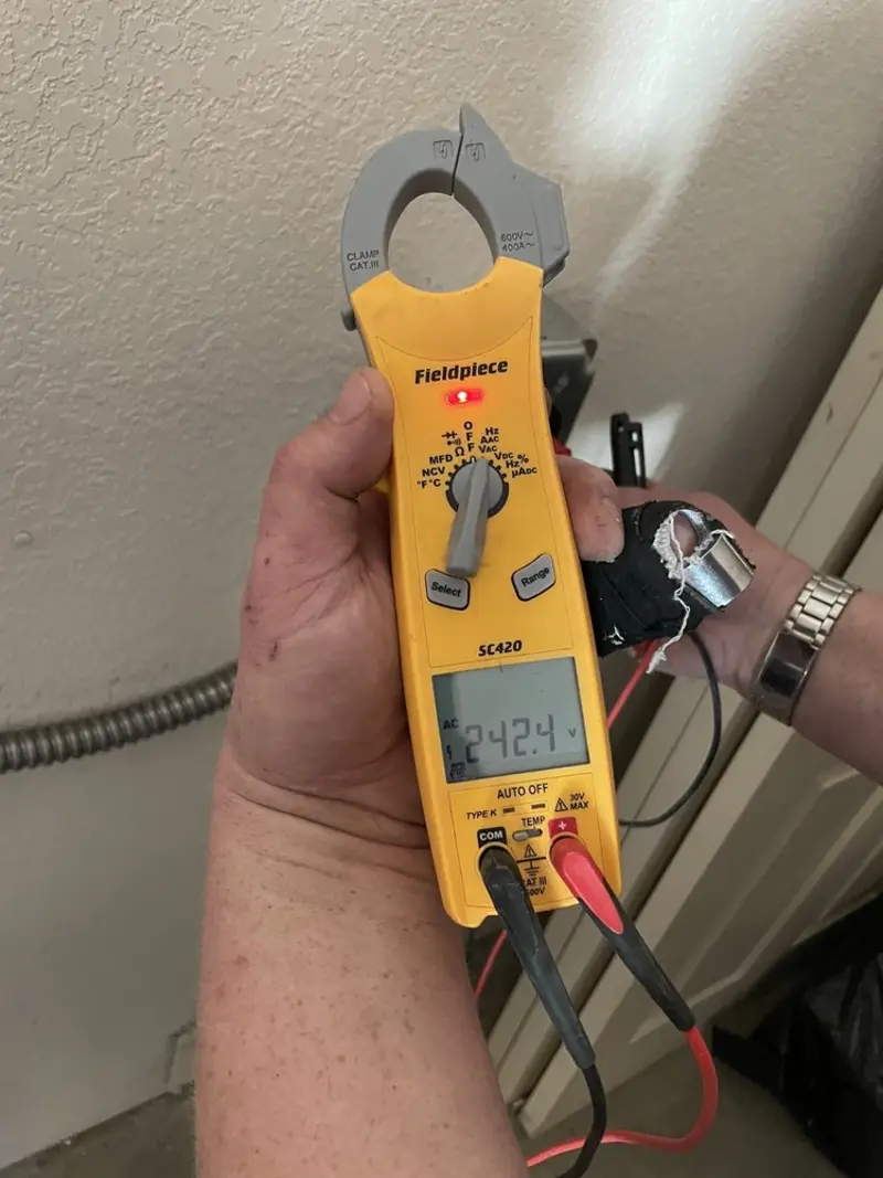 Voltage testing with clamp meter during Ceiling Fan Installation in Westminster